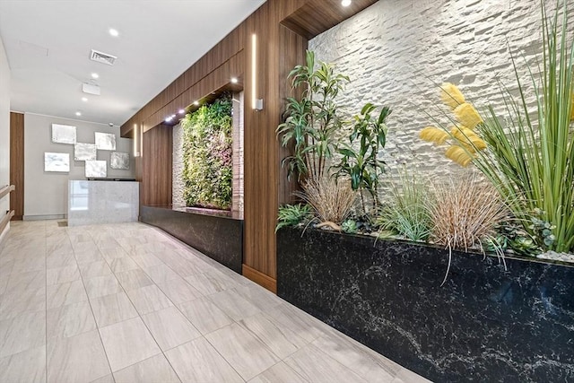 121 Portland St Unit Ph3, Boston, MA 02114 - reception area featuring wooden walls and recessed lighting