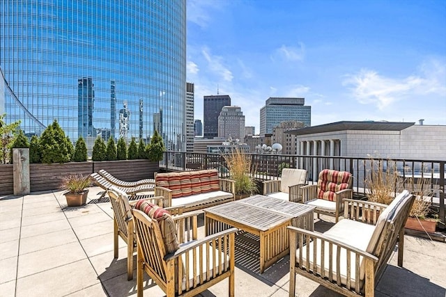 121 Portland St Unit Ph3, Boston, MA 02114 - view of patio with an outdoor hangout area and a skyline view