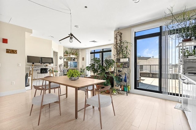 121 Portland St Unit Ph3, Boston, MA 02114 - dining space with wood finished floors and healthy amount of natural light