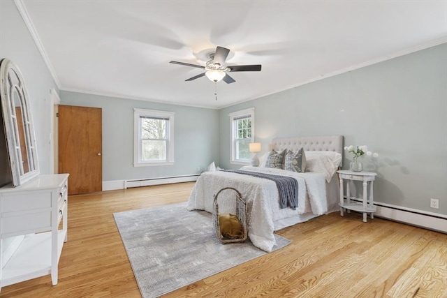 bedroom with baseboard heating, ceiling fan, crown molding, and light hardwood / wood-style floors