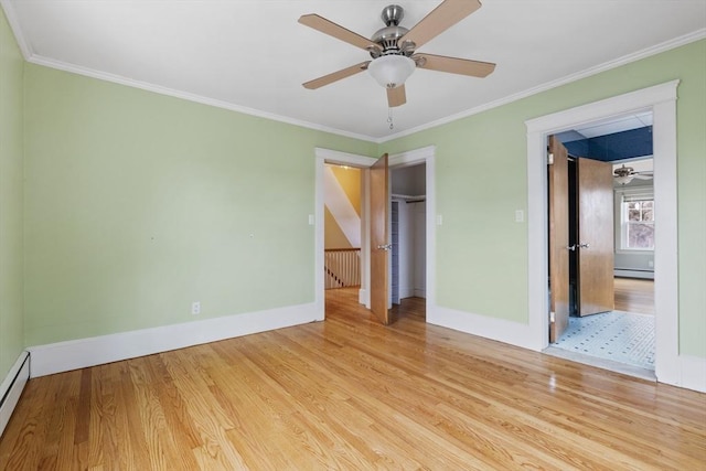 unfurnished bedroom with ceiling fan, light wood-type flooring, ornamental molding, and a baseboard radiator