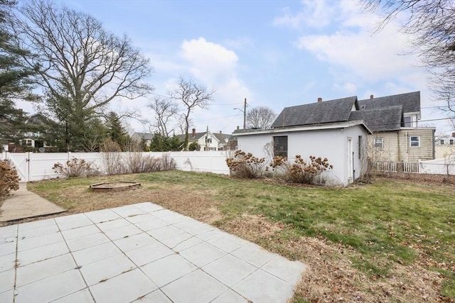 view of yard with a patio and a fire pit