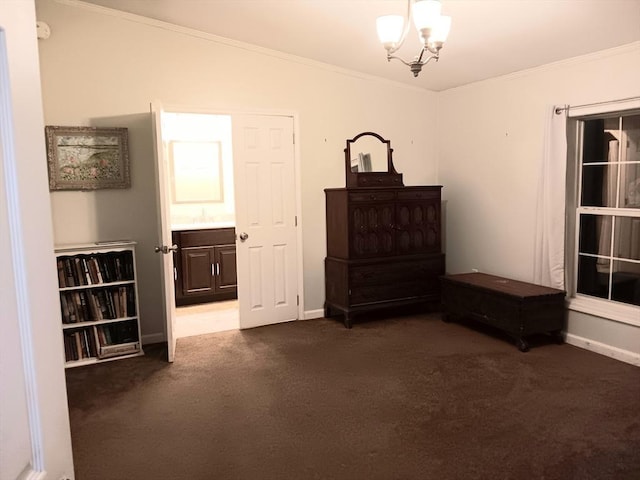 interior space featuring baseboards, ornamental molding, dark colored carpet, and a notable chandelier