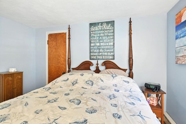 bedroom with a baseboard heating unit