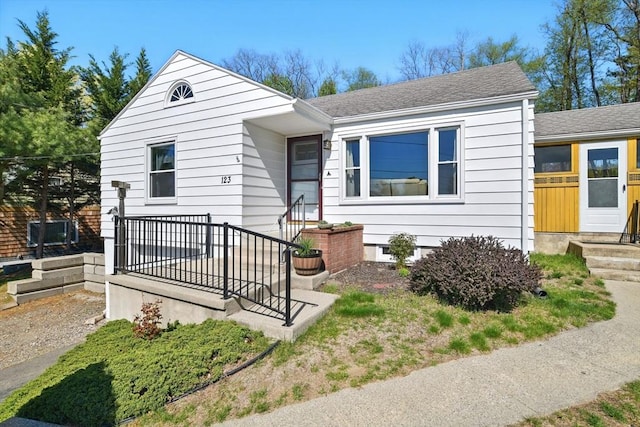 view of front of property with a shingled roof