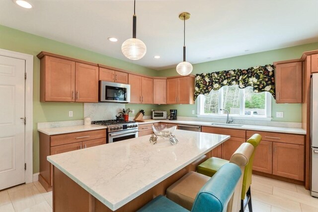 26 Crosswinds Way, Falmouth, MA 02536 - kitchen with stainless steel appliances, recessed lighting, a kitchen island, a sink, and pendant lighting
