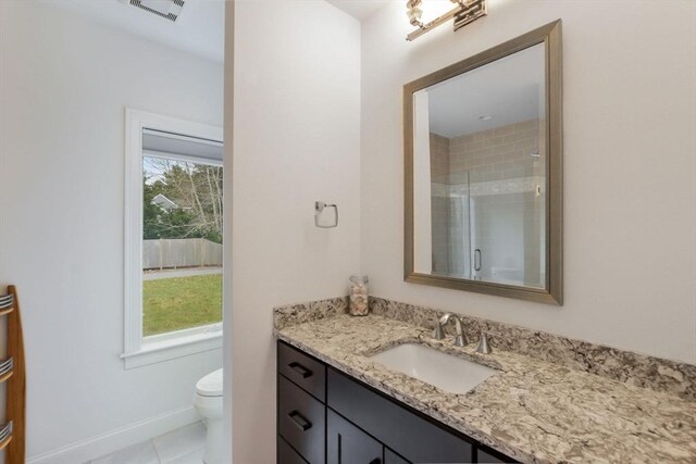 26 Crosswinds Way, Falmouth, MA 02536 - bathroom with toilet, a shower with door, a healthy amount of sunlight, and visible vents