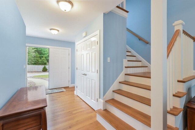 26 Crosswinds Way, Falmouth, MA 02536 - entrance foyer with baseboards, stairs, and wood finished floors