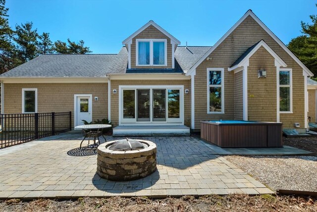 26 Crosswinds Way, Falmouth, MA 02536 - rear view of house with fence, a shingled roof, a hot tub, and a patio area