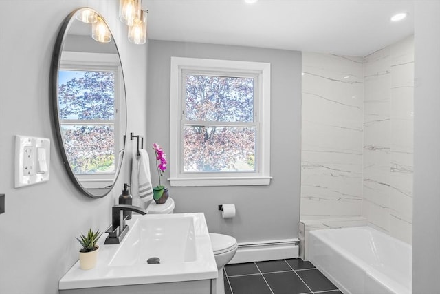 full bath featuring a baseboard heating unit, a healthy amount of sunlight, and toilet