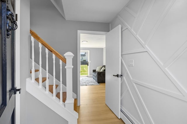 staircase with wood finished floors