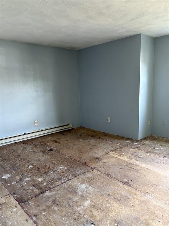 740 Central St Unit J11, Leominster, MA 01453 - spare room featuring a baseboard heating unit