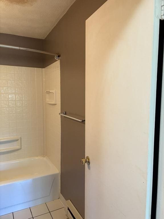 740 Central St Unit J11, Leominster, MA 01453 - full bathroom with tile patterned flooring,  shower combination, and a textured ceiling