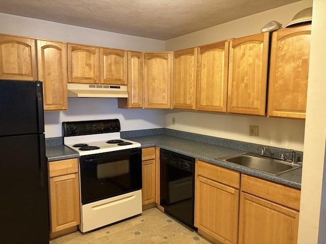 740 Central St Unit J11, Leominster, MA 01453 - kitchen with black appliances, under cabinet range hood, dark countertops, light floors, and a textured ceiling