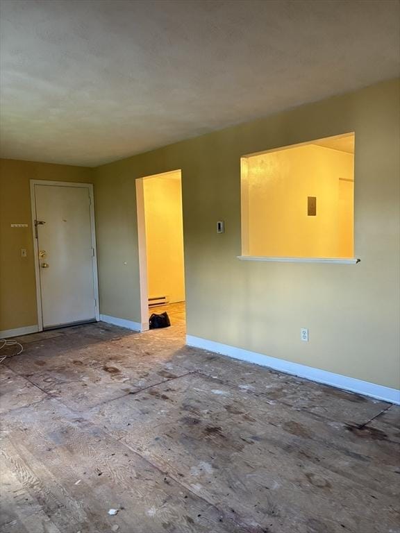 740 Central St Unit J11, Leominster, MA 01453 - spare room featuring baseboards and a baseboard heating unit