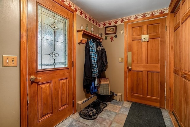 doorway to outside featuring a baseboard radiator