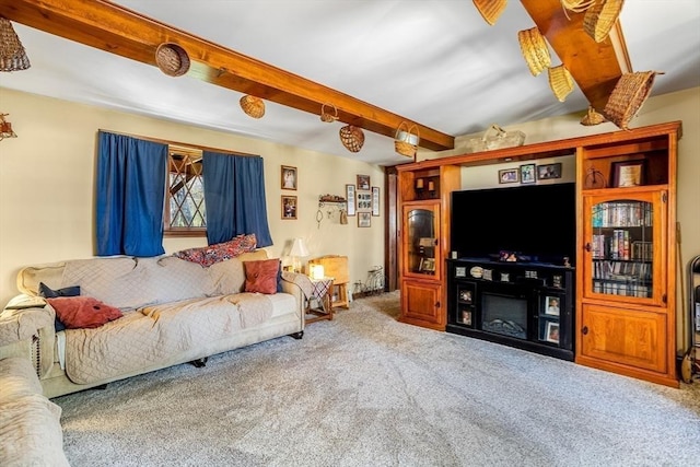 living room with carpet and beam ceiling