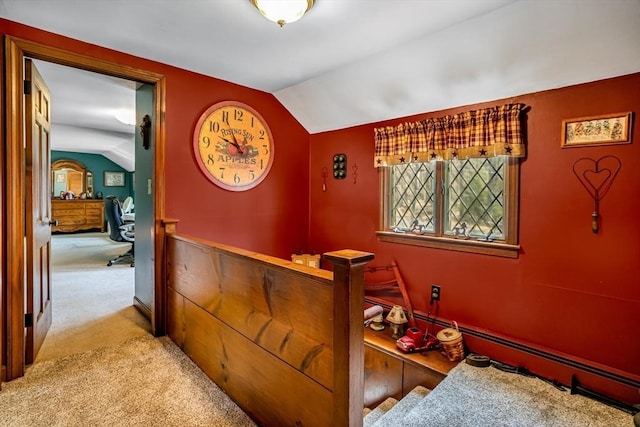 interior space with light colored carpet, lofted ceiling, and a wealth of natural light