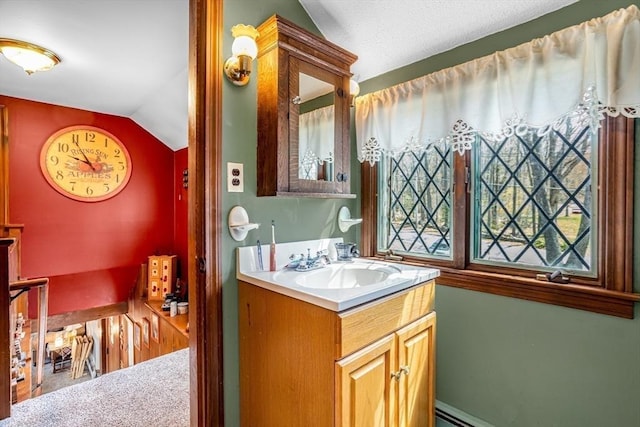 bathroom featuring vanity and lofted ceiling