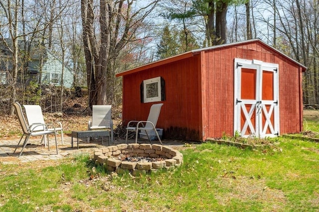 view of shed featuring a fire pit