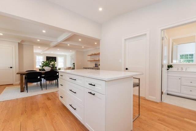 12 Cuba St Unit 12, Watertown, MA 02472 - kitchen featuring white cabinets, plenty of natural light, a center island, recessed lighting, and light wood finished floors