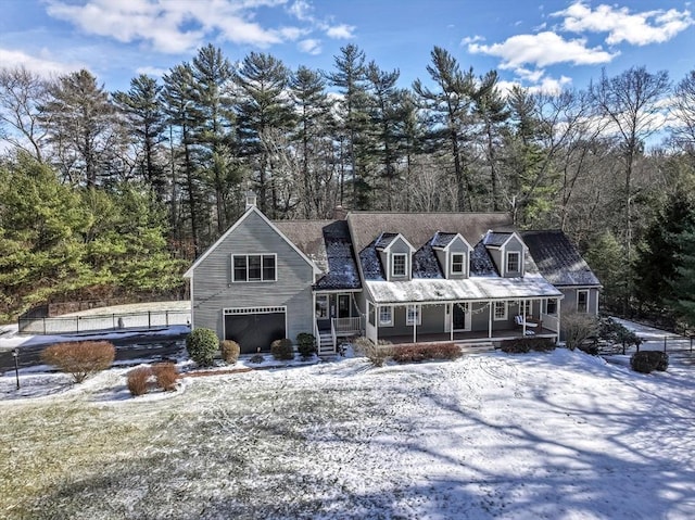 view of front of home featuring a porch and a garage