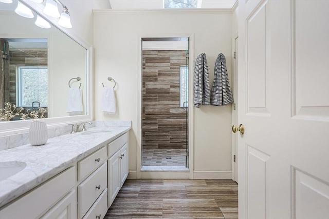 bathroom featuring vanity and a tile shower