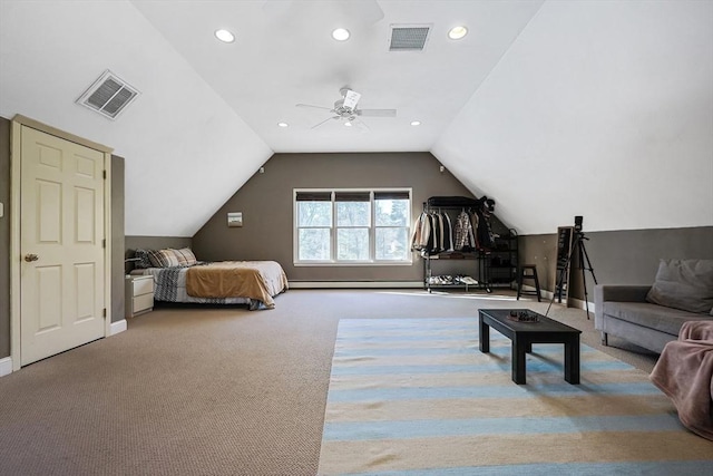 carpeted bedroom featuring vaulted ceiling, ceiling fan, and baseboard heating