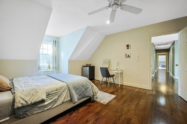 bedroom featuring lofted ceiling, dark hardwood / wood-style floors, and ceiling fan