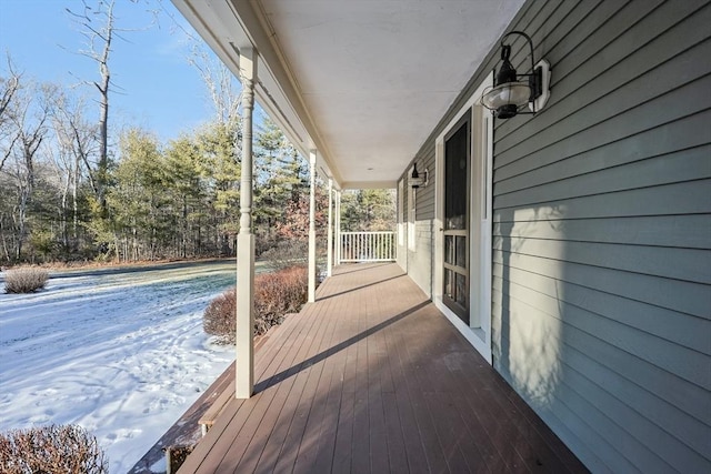 wooden terrace with a porch