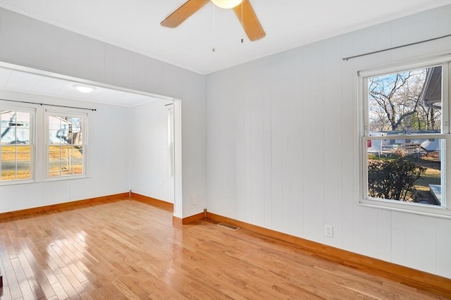 spare room featuring ceiling fan and light wood-type flooring