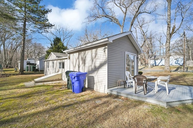 exterior space with a wooden deck and a yard