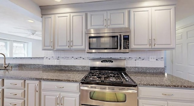 32 Nelson Ave, Beverly, MA 01915 - kitchen featuring white cabinetry, backsplash, and appliances with stainless steel finishes