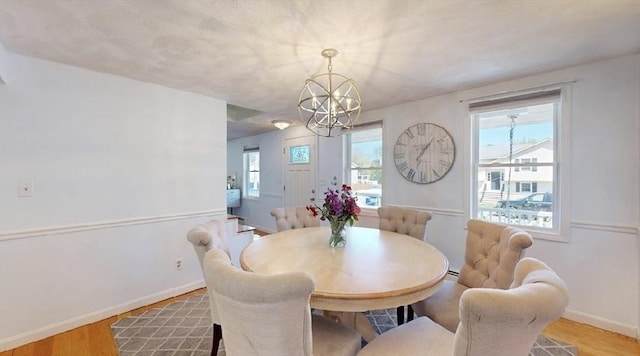 32 Nelson Ave, Beverly, MA 01915 - dining space featuring baseboards, a notable chandelier, and light wood-style flooring