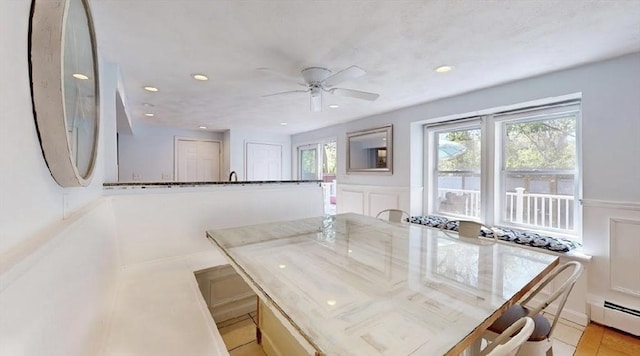 32 Nelson Ave, Beverly, MA 01915 - dining space featuring a ceiling fan, a decorative wall, wainscoting, baseboard heating, and recessed lighting