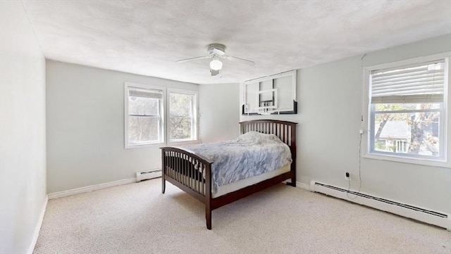 32 Nelson Ave, Beverly, MA 01915 - bedroom with a ceiling fan, light carpet, baseboards, and a baseboard radiator