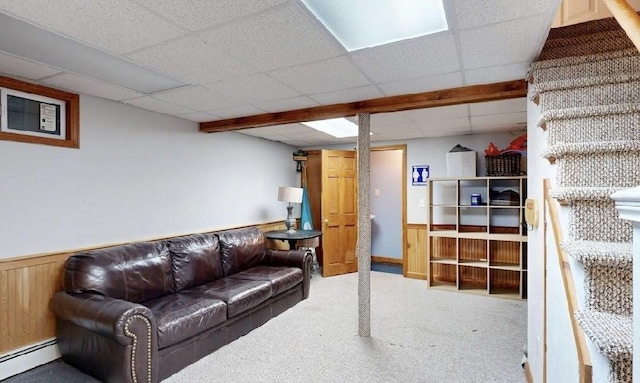 32 Nelson Ave, Beverly, MA 01915 - carpeted living room featuring wainscoting, wood walls, baseboard heating, and a drop ceiling