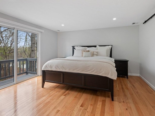 bedroom featuring visible vents, access to exterior, light wood-type flooring, baseboards, and recessed lighting