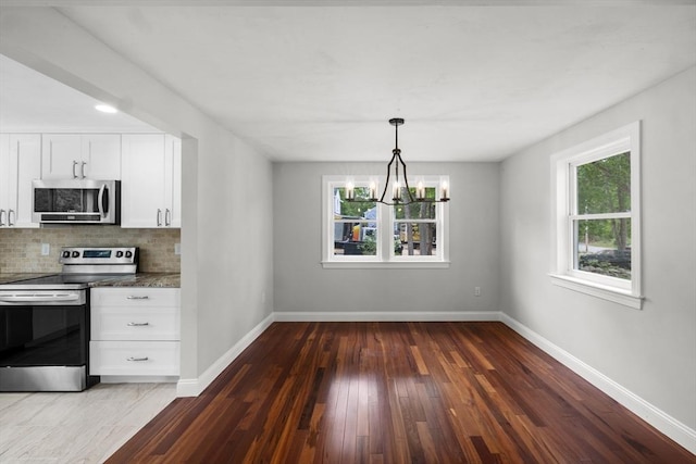67 Great Neck Rd, Wareham, MA 02571 - kitchen with appliances with stainless steel finishes, healthy amount of natural light, hardwood / wood-style floors, and baseboards