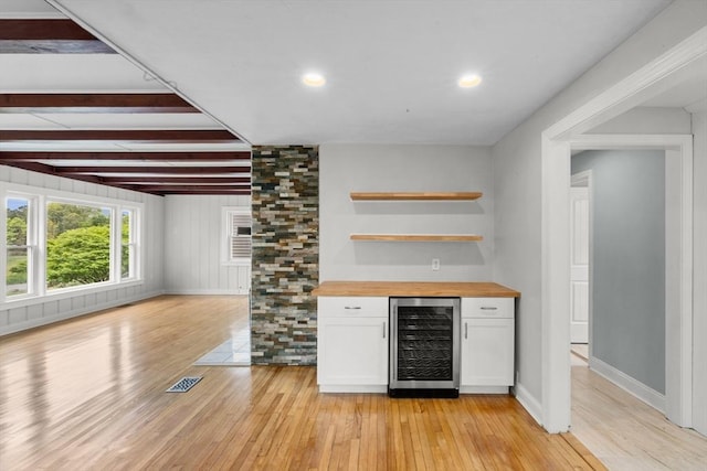 67 Great Neck Rd, Wareham, MA 02571 - indoor dry bar featuring beverage cooler, light wood finished floors, beamed ceiling, baseboards, and recessed lighting