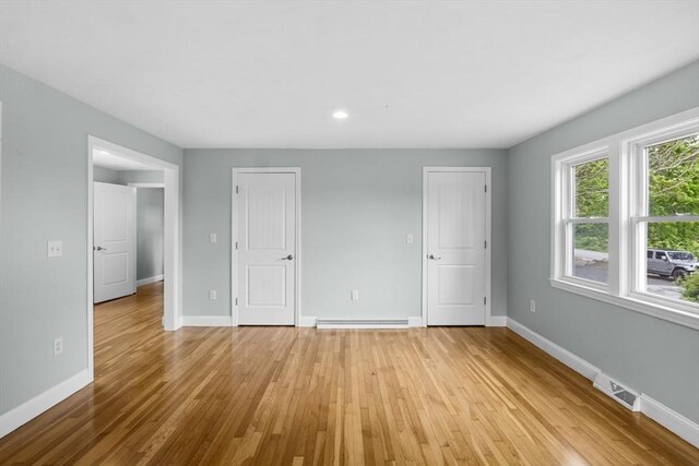 67 Great Neck Rd, Wareham, MA 02571 - unfurnished bedroom featuring baseboards, light wood-style floors, two closets, and recessed lighting