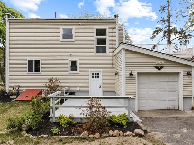 67 Great Neck Rd, Wareham, MA 02571 - back of house with a garage and asphalt driveway