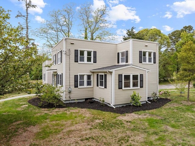 67 Great Neck Rd, Wareham, MA 02571 - rear view of house featuring a lawn