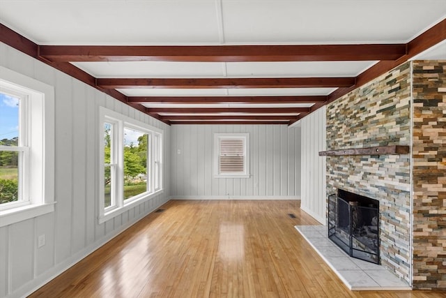 67 Great Neck Rd, Wareham, MA 02571 - unfurnished living room featuring light wood finished floors, a large fireplace, and beamed ceiling
