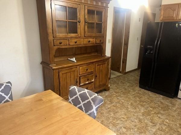 kitchen featuring black fridge