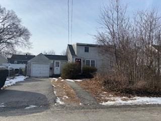 front of property with a garage