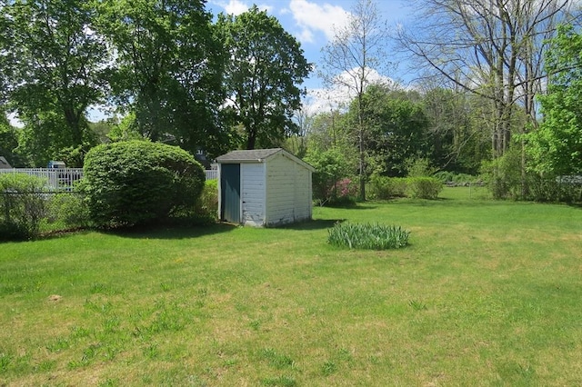 view of yard with a storage shed and an outdoor structure