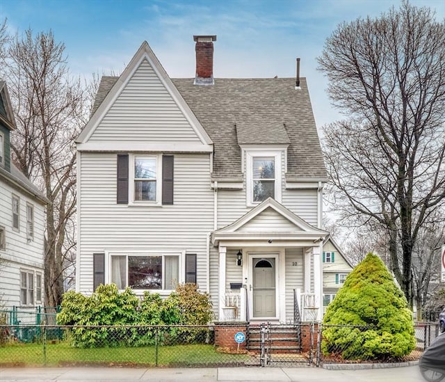 10 Windom St, Boston, MA 02134 - victorian-style house with a shingled roof, a chimney, and a fenced front yard
