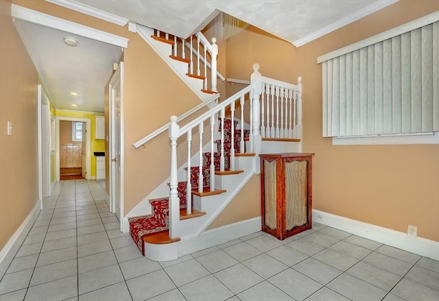 10 Windom St, Boston, MA 02134 - stairway with tile patterned flooring, baseboards, and crown molding