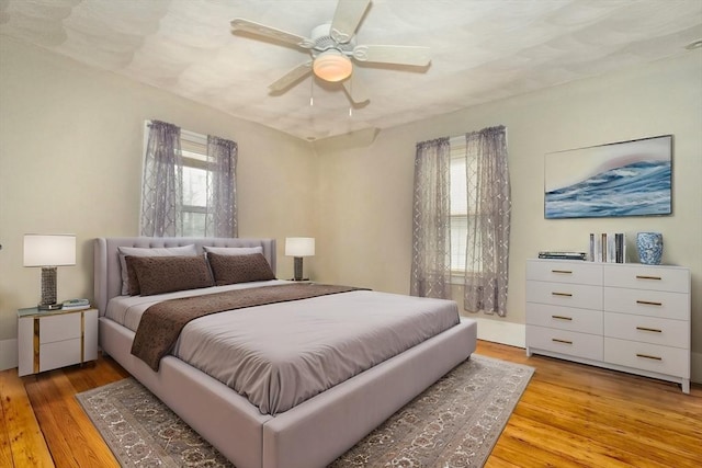 10 Windom St, Boston, MA 02134 - bedroom with ceiling fan and light wood-style floors